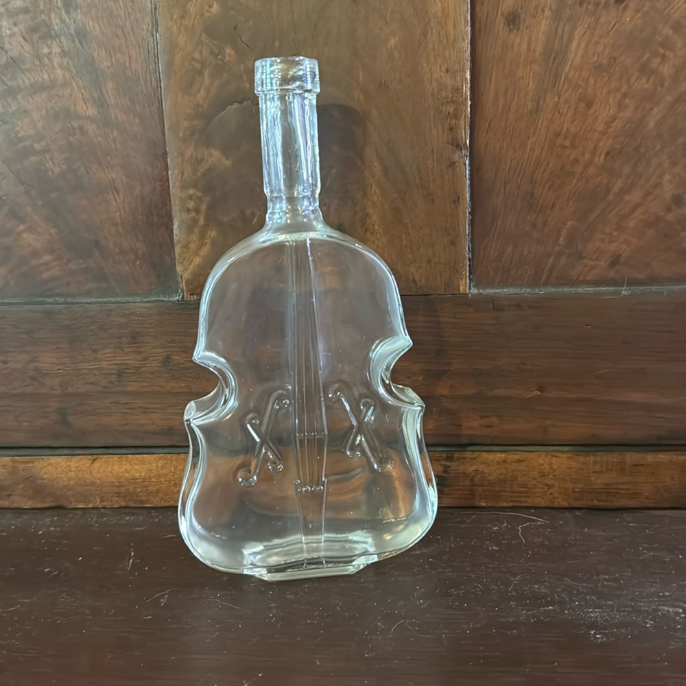 This is a vintage bottle that looks like a cello.
